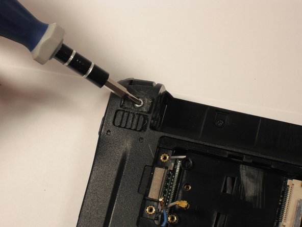 Remove three 3.9 mm  Phillips #1 screws  from the battery compartment.