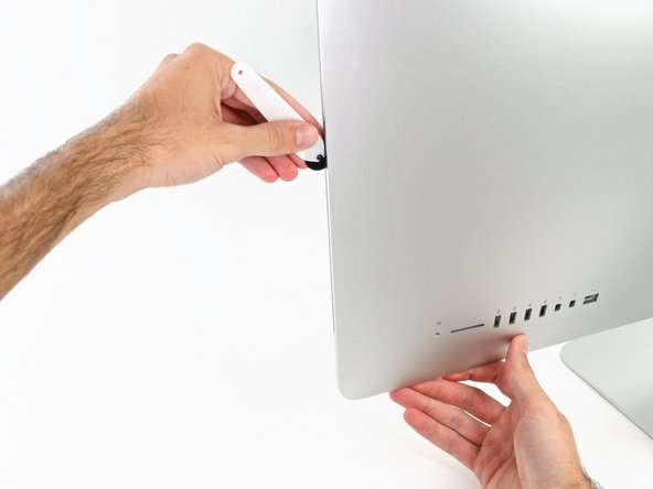 Image 1/2: At this point, you'll want to run the tool back around the entire display, to ensure you cut as much adhesive as possible.