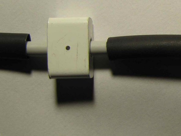 Image 1/1: Cut the smallest diameter sleeve to 2cm long. Once shrunk into place the white plastic outer will need to fit over this. You might wish to check that this will work, as otherwise you will need to enlarge the hole in the housing (now, not later!).