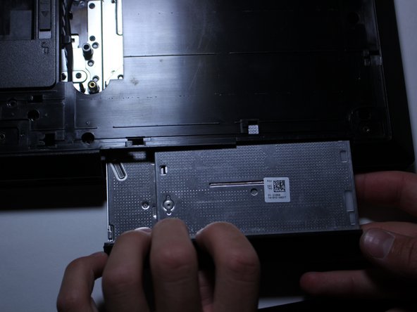 Using your hand (you might need to use both), pull outwards to slowly remove your Optical Disk Drive from your computer.