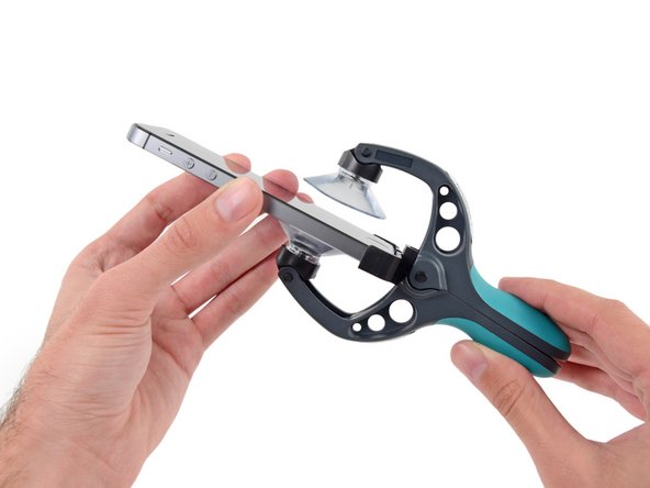 Image 2/3: Place the bottom of your iPhone in between the suction cups, against the plastic depth gauge.