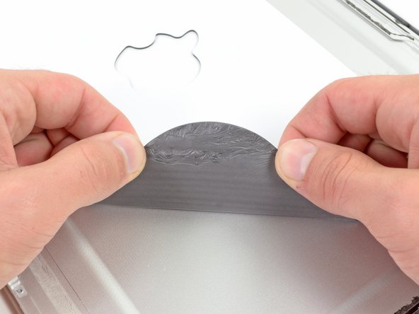 Image 1/2: We suspect that the foam is there to provide a flat, even surface for the LCD glass to brace against. But there is one thing that we do know about it: it is super sticky.