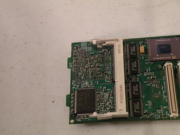 Image 3/3: Now, remove it by pushing the tabs, it should pop up, and you can set it aside.