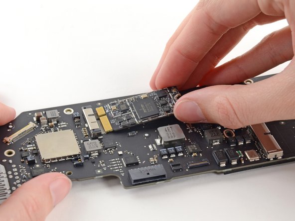 Image 2/2: Remove the AirPort/Bluetooth board from the logic board.