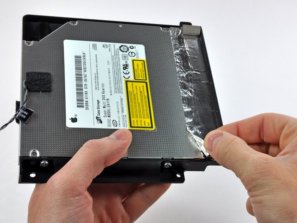 Image 2/2: It is not necessary to peel all of the EMI tape off the optical drive bracket.