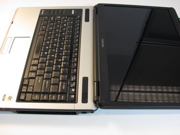 Flip the laptop over so it is rightside up, and open the laptop all the way so that the screen is horizontal.