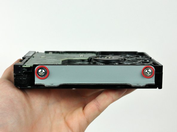 Image 1/2: Remove the hard drive bracket.