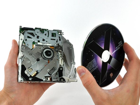 Image 1/1: If a disk is stuck in the drive, simply lift it off the spindle motor.