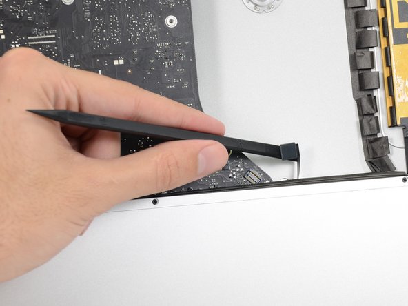 Image 3/3: Push the cable slightly to the right.