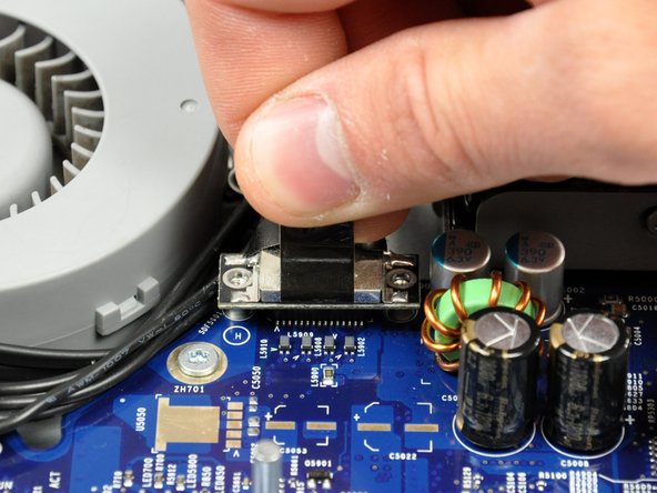 Image 2/2: Using its black pull tab, pull the display data cable connector straight up off its socket on the logic board.