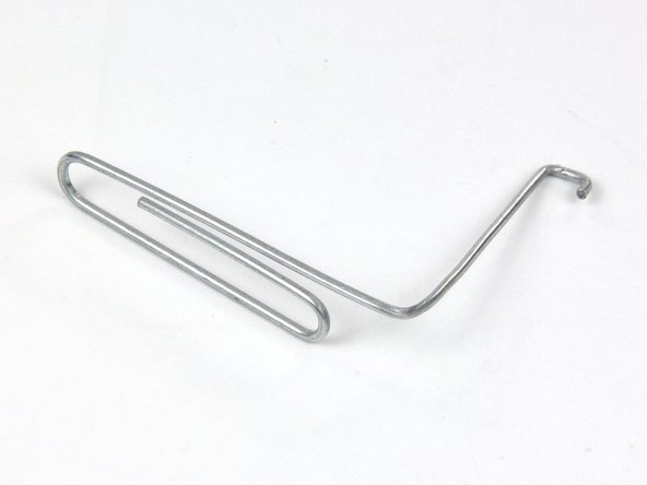 Image 1/3: Due to tight tolerances, you will have to use a thin hooked tool to lift the display out of the outer case. As seen in the first picture, we made one out of a bent paperclip.