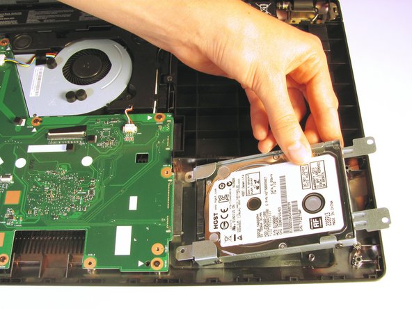 Once it is free, remove the hard drive from its internal cavity.