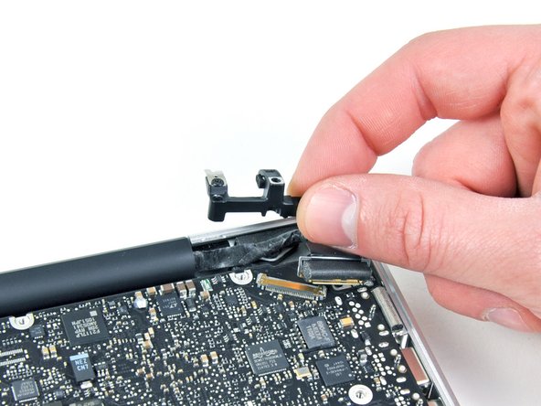 Image 2/2: One 5.5 mm Phillips screw