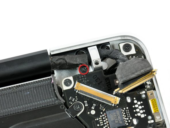 Image 1/2: This screw may remain captive in the LVDS cable.