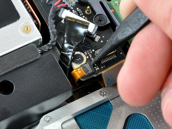 Image 1/2: Pull the IR/sleep LED ribbon cable straight out of its socket.