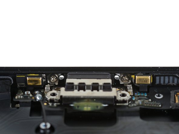 Image 2/3: It seems like Apple has taken our [http://ifixit.org/blog/8242/headphone-jack-iphone/|new_window=true|warning] to heart. Without a headphone jack to bear the burden of audio connections, this port will get a lot more wear, and it's been well reinforced.