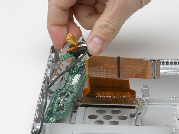 Image 1/1: Lift the DC/Sound card out of the computer and turn it over.