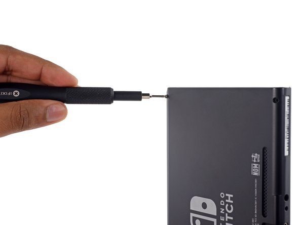 Image 1/3: Tri-points are Nintendo's version of a "Keep out" sign, but once you're past them the back cover lifts off easily—no clips or adhesive.