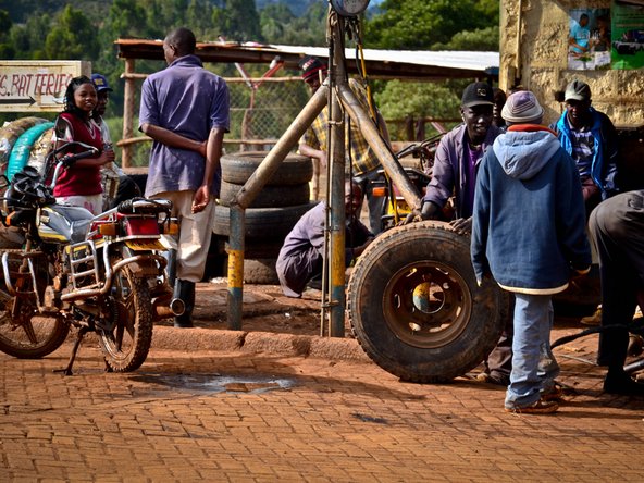 Seating a tire bead at an auto repair shop in Kenya