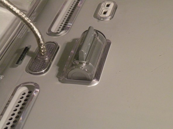 Image 2/2: The Piece of plastic under the swing arm, you need to remove this(2nd Photo).