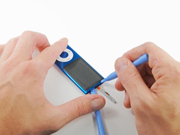 Image 1/1: Remove the first iPod opening tool from between the glass and LCD in the top of the device.