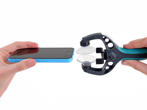 Image 1/3: Close the handle on the iSclack, opening the suction-cup jaws.