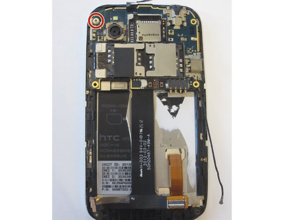 Gently unstick black ribbon cable from the chassis.