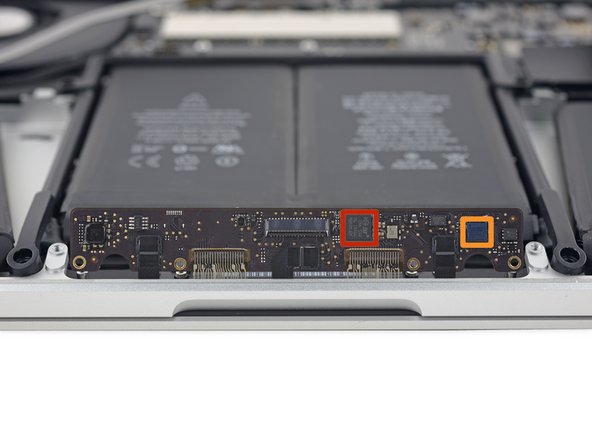 Image 2/2: The new trackpad board has some interesting ICs: