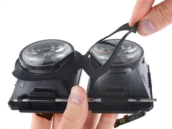 Image 3/3: Ready to go deeper, we remove the twin lens-and-display assemblies from their housing and peel off the rubber light-gasket from around the lenses.