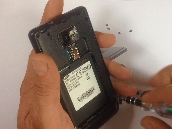 Remove the 7 screws highlighted in red.