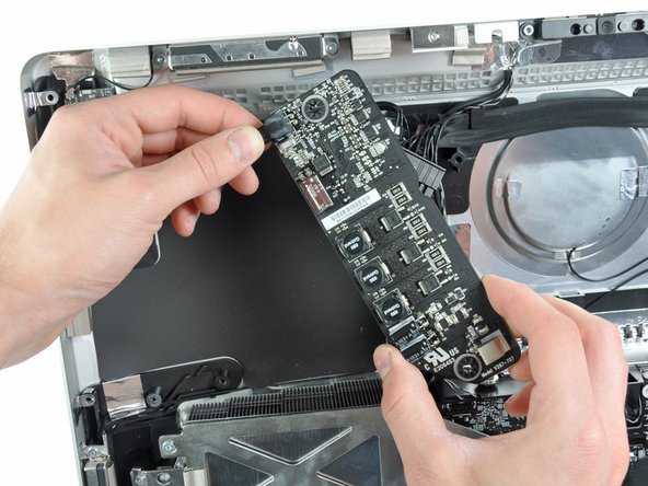 Image 3/3: Removing the power supply requires disconnecting the AC inlet cable from the logic board.