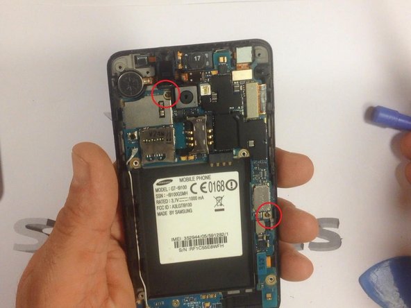 The mother board is held by 2x screws. Remove them.