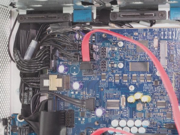 Image 2/2: Insert the L shaped SATA cable into the top SATA port on the logic board.