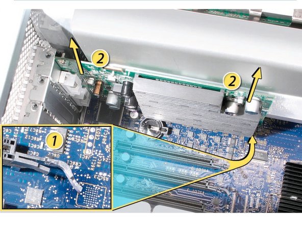 Image 1/1: 1) Release the small locking clip at the front of the card’s logic board connector by pushing the clip up toward the media shelf.