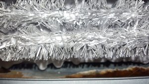 What causes frost to build up in a freezer?